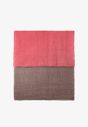 Two textured fabric pieces, one in a coral shade and the other in brown, featuring a ribbed pattern and a rectangular shape.