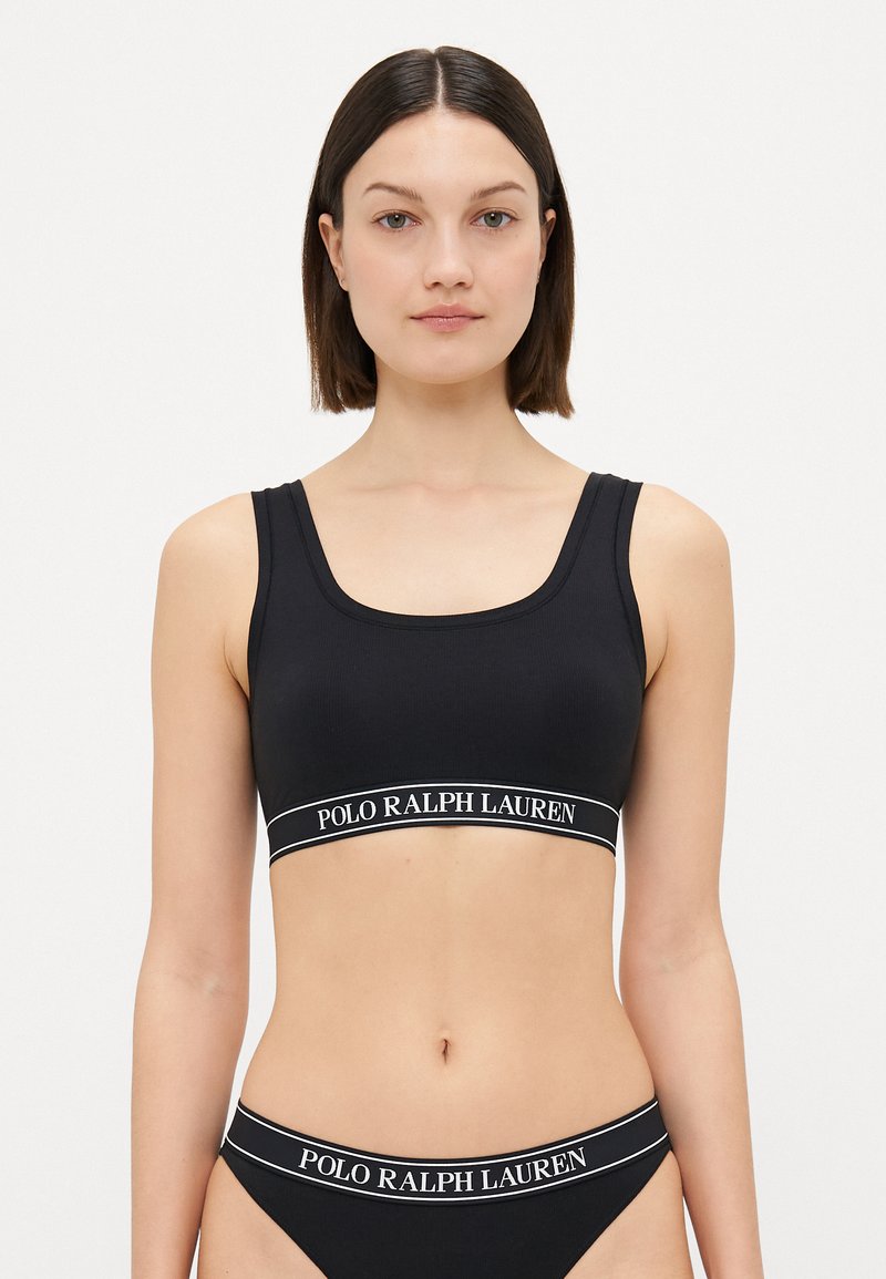 Black sports bralette with a square neckline and wide straps. Features a branded elastic band with "POLO RALPH LAUREN" in white text.