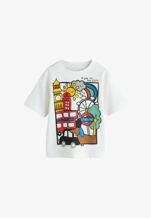 White t-shirt with colorful London-themed illustration including Big Ben, double-decker bus, black taxi, London Eye, rainbow, sun, cloud, and a dog.