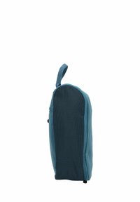 Bolsa de tela azul y azul oscuro con forma redondeada, cierre de cremallera y un asa superior para fácil transporte, con una superficie texturizada.