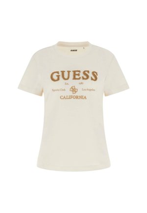 Kremkrāsas kokvilnas t-krekls ar apaļu kaklu, īsām piedurknēm un reljefu zelta izšuvumu ar uzrakstiem "GUESS", "California" un citiem detaļām.