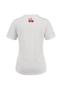 T-shirt en coton blanc avec des manches courtes et un col rond. Le dos présente un petit design brodé de deux cerises rouges.