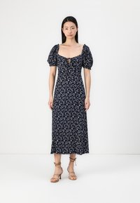 Vestido midi azul marinho floral com mangas bufantes, decote quadrado e detalhe em gota na frente. Tecido leve, ajustado na cintura, saia fluida.