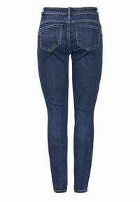 Kitsad teksad tumesinises denimis. Tagaküljel on kaks taskut, millel on kerge tuhmumine. Sirge lõige sujuva tekstuuri ja ilma kaunistusteta.