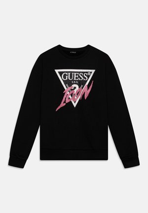 Sudadera negra con un logo triangular blanco que presenta "GUESS U.S.A." y un "ICON" rosa en letras estilizadas. Puños y dobladillo de canalé.
