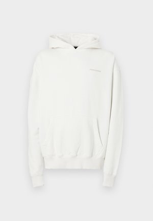 White hooded sweatshirt with a front pocket, ribbed cuffs, and hem. Material is soft and textured. Logo subtly displayed on the chest.