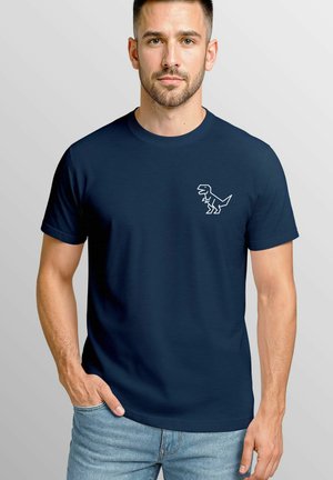Navy blue cotton T-shirt featuring a minimalist white dinosaur graphic on the left chest. Short sleeves and a crew neckline.