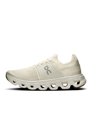 Light beige athletic shoe with lace-up design, cushioned sole with hollow segments, and gray "ON" logo on the side.