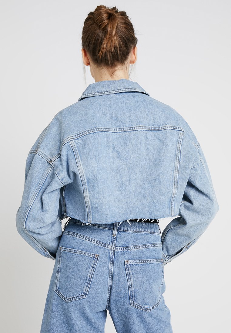 hacked off denim jacket
