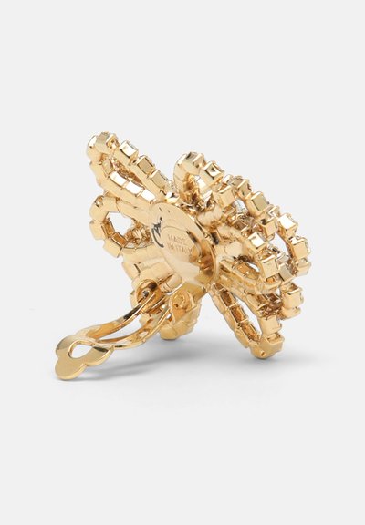 Zelta krāsas matu spraude ar ziedu dizainu, izceļas ar kvadrātveida akcentiem un gludu tekstūru. Aprīkota ar metāla sprādzi drošai piestiprināšanai.