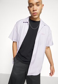 Edwin OVERSIZE BASIC UNISEX - Lihtne T-särk - black