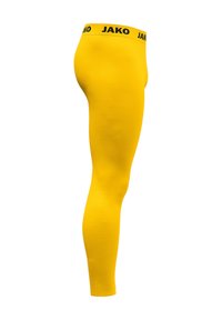 Leggings gialli in tessuto elasticizzato, con vita nera recante il nome del marchio "JAKO". Texture liscia e design aderente.