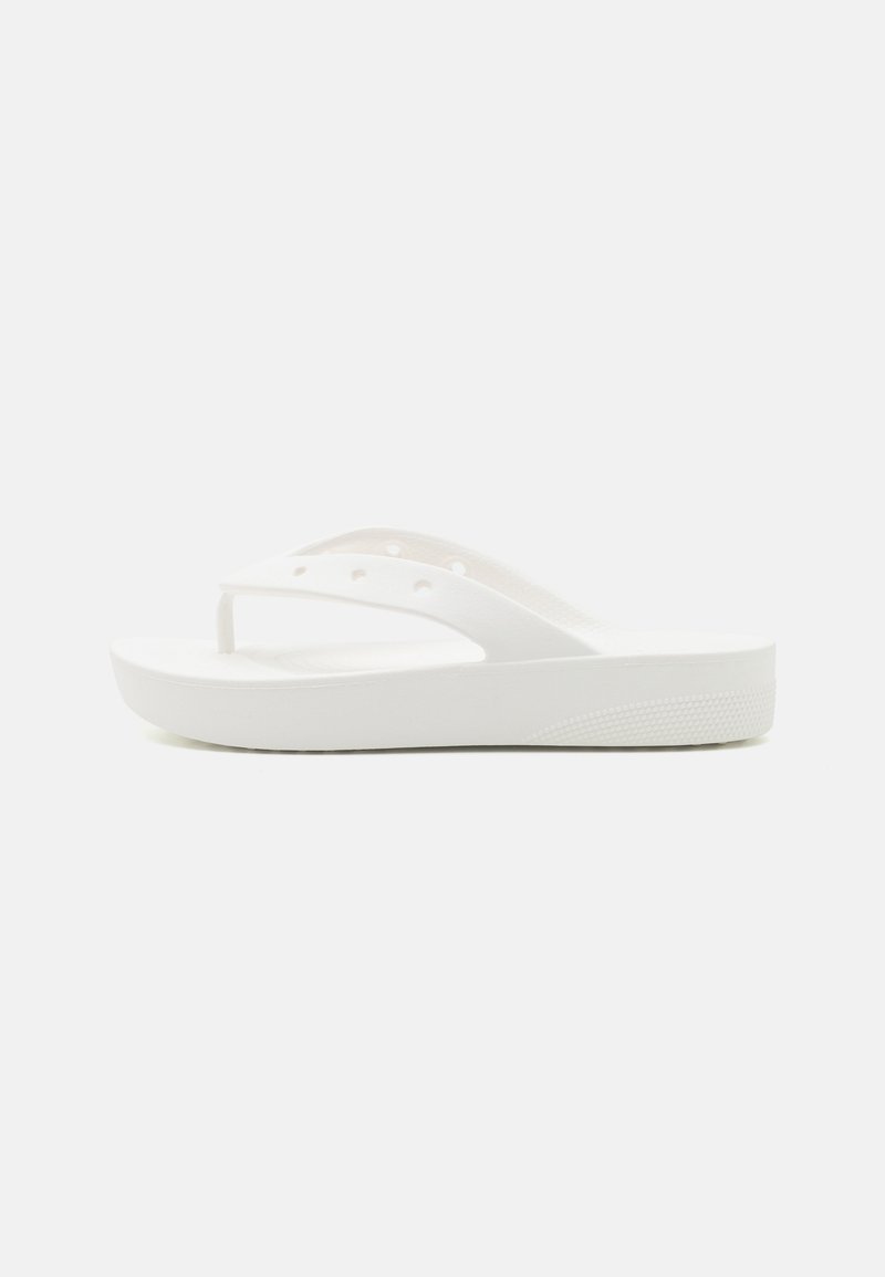 White flip-flop sandal with a textured footbed, elevated sole, and thin straps. Made of rubber-like material with no visible hardware.