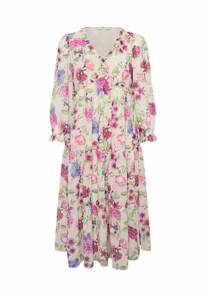 El vestido maxi floral presenta un escote en V, mangas largas y una falda de volantes con un estampado floral en rosa, púrpura y verde sobre un fondo claro.