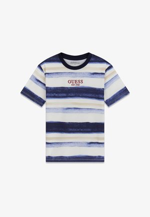 Tricou cu dungi în nuanțe de bleumarin, crem și albastru deschis, cu decolteu rotund. Prezintă logo-ul îndrăzneț „GUESS EST.1981” în roșu, amplasat central. Confectionat din bumbac.