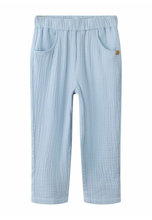 Hele sinise pehme tekstuuriga elastse vöökohaga püksid, millel on ees taskud ja parema tasku küljes väike pruun silt.