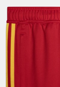 adidas Performance TIRO NATIONS PACK UNISEX - Treniņtērpa apakšdaļas - better scarlet/legend ink/bold gold