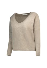 Maglione beige a maglia con scollo a V, maniche lunghe e tessuto morbido. Presenta una vestibilità leggermente ampia e un orlo a coste.