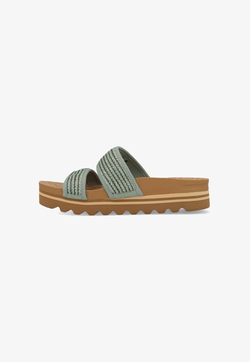 Groene slide sandalen met twee textuuroverlays, kurken voetbed en een dikke, bruine rubberen zool met zigzagprofiel.