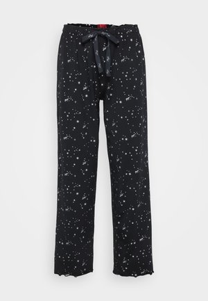 Svarta pyjamasbyxor med lös passform, prydda med ett stjärnmönster i vitt. Inkluderar midjeband med elastisk resår och en knytbandstängning.