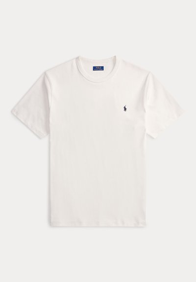 T-shirt blanc à manches courtes et col rond avec petit logo Polo Ralph Lauren bleu foncé sur le côté gauche de la poitrine.