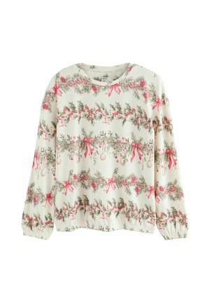 Sweatshirt à manches longues en crème avec des motifs festifs de houx vert et de rubans rouges. Il présente des poignets froncés et un col rond.