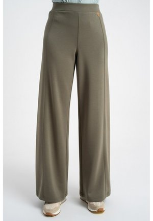 Spodnie o szerokich nogawkach w oliwkowym kolorze, noszone z beżowymi trampkami, przedstawione od pasa do stóp na jednolitym jasnym tle.