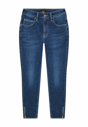 Mørkeblå denim jeans med slim fit, fem-lomme design og lynlåse ved anklerne. Har subtil falming og kontrasterende syninger.