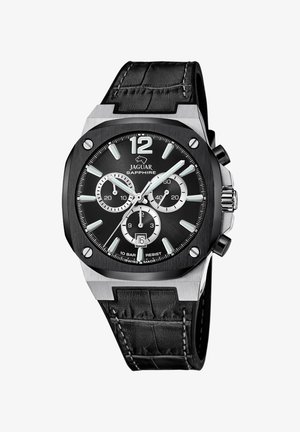 Black croc-textured leather strap watch with a silver stainless steel case, black dial, luminous accents, and chronograph features.