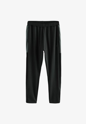 Mustad mustrendid mustad spordipüksid elastse vöökohtaga, küljetaskutega ja hallide aktsentidega külgedel. Sile ja kerge kangas.