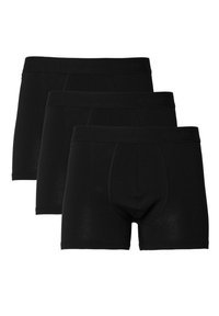 Schwarze Baumwoll-Boxershorts, mit enger Passform, elastischem Bund mit Markenlogo und glatter Textur. Drei Paare ausgestellt.