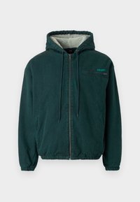 Green hooded jacket made of soft fabric. Features a zip front, elastic cuffs and hem, and a fleece-lined interior with a chest pocket.