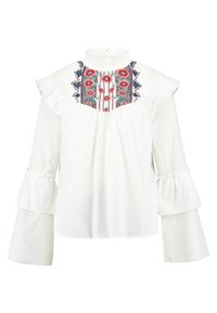 Vit långärmad blus med volangdetaljer, hög krage och färgglad blommig broderi på bröstet. Mjuk, texturerad tyg.