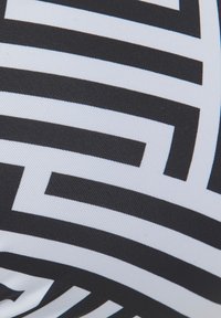 Black and white fabric featuring a geometric pattern of thick, bold lines in a smooth texture, with alternating colors creating visual contrast.