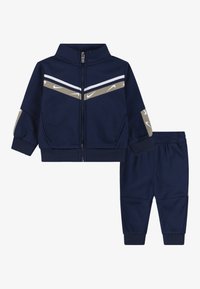 Nike Sportswear CLUB PROPUS UNISEX SET - Pantaloni de trening - midnight navy
