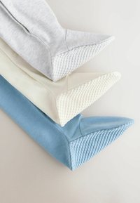 Three sleeve ends in grey, cream, and blue cotton blend with textured, rubberized accents. Each features a pointed tip and button details.