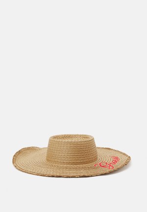 Wide-brimmed woven straw hat with a flat top and frayed edges, featuring red cursive text embroidered on the brim.