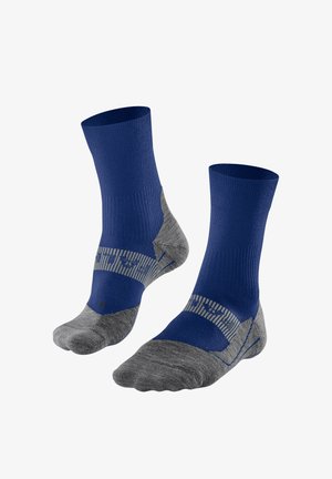 Blaue und graue Socken mit einem gerippten oberen Teil, gepolstertem Fußbett und gestreiften Details. Hergestellt aus feuchtigkeitsableitendem Material für optimale Leistung.