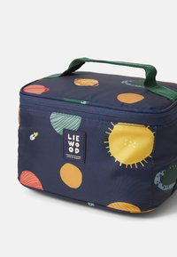 Insulated navy lunch bag with green handle, featuring multicolored celestial patterns and a logo tag. Rectangular shape, durable fabric.