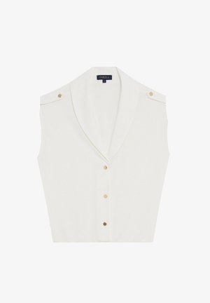 Blusa blanca sin mangas con cuello chal, que cuenta con botones en tono dorado en los hombros y en la parte delantera. Fabricación de tejido suave con un diseño limpio.