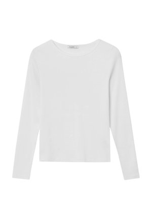 Top à manches longues blanc en coton doux. Présente un col rond, une coupe ajustée et ne comporte aucun motif ni élément métallique visible.