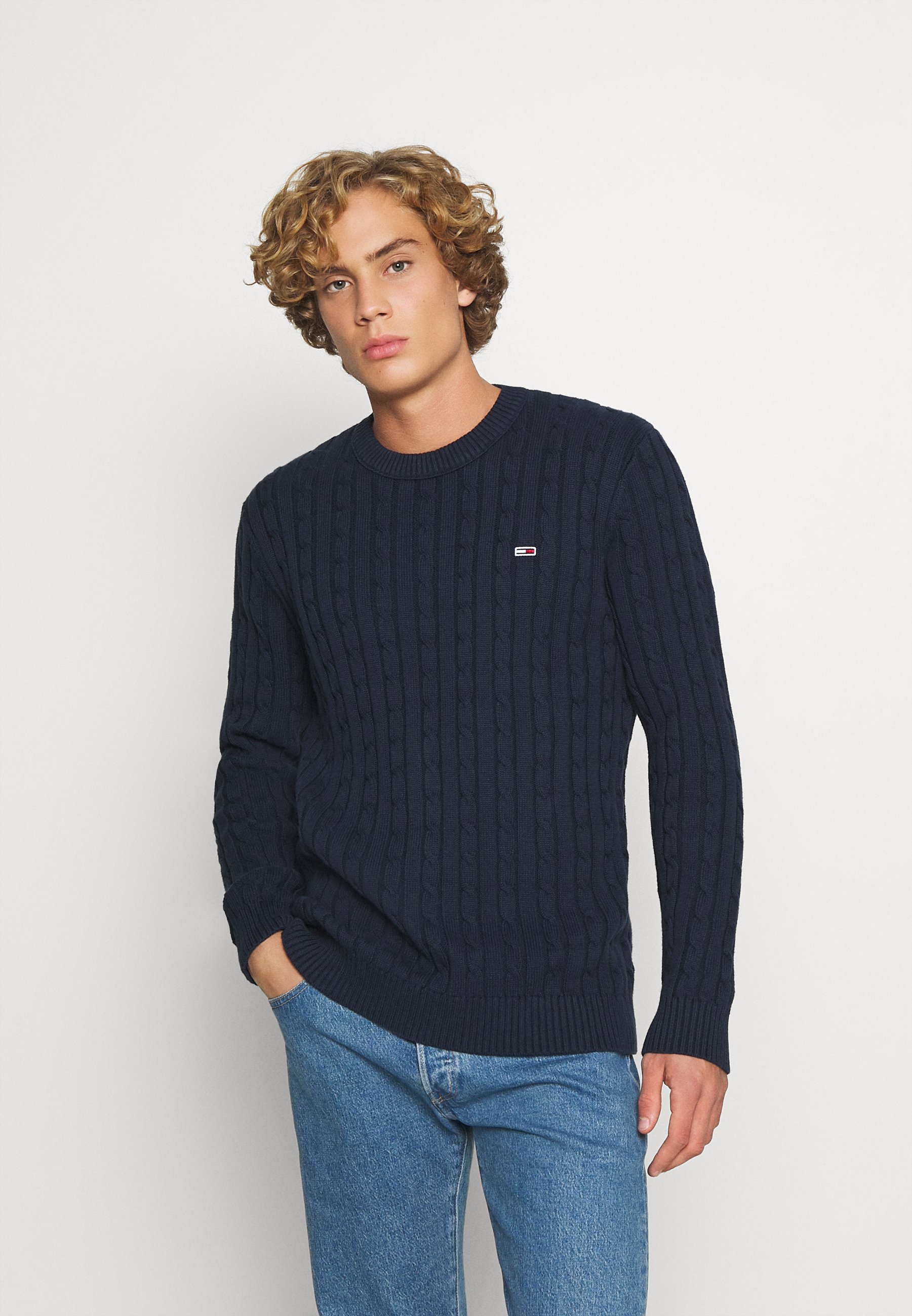 grey jumper blue jeans