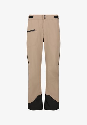 Beige ulkoiluhousut, joissa on mustat vahvistetut lahkeet, vetoketjullinen sivutasku, säädettävät vyötärönauhat ja tuplapainonappi kiinnitys.