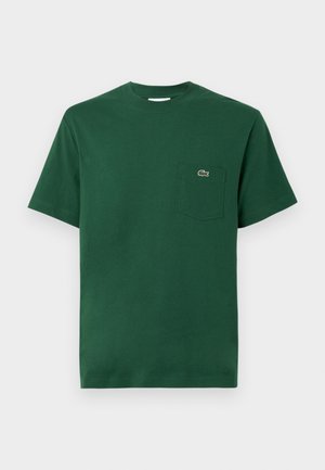 Grünes Baumwoll-T-Shirt mit Rundhalsausschnitt, kurzen Ärmeln und einer linken Brusttasche mit einem kleinen gestickten Logo.