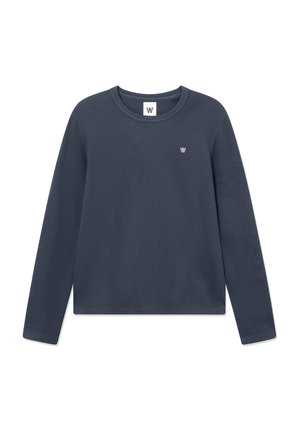 Long-sleeve dark gray crewneck shirt with small white logo on left chest and tag inside collar on plain white background.