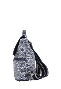 Navy and white patterned tote bag with a geometric design, featuring a textured fabric, adjustable strap, and a side pocket.