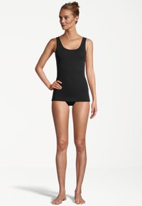 Black tank top with a scooped neckline and wide straps, made of a smooth, stretchy material, designed for casual wear.