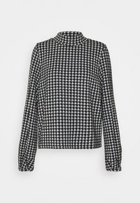 Blouse à manches longues en motif pied-de-poule noir et blanc avec un col haut et des manches légèrement froncées, fabriquée dans un tissu texturé.