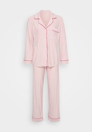 Red and white striped pajama set made of soft fabric, featuring a button-up top with a pocket and long pants with contrasting trim.