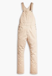 Peto de pana beige con rayas verticales, piernas rectas, tirantes ajustables, bolsillo en el pecho y detalles de botones en los lados.